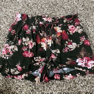 Dark green shorts with red and pink flowers